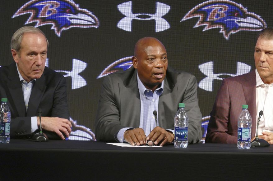 Baltimore Ravens general manager Ozzie Newsome, center, speaks as team president Dick Cass, left, and owner Steve Bisciotti listen during an NFL football news conference, Tuesday, Jan. 10, 2017, in Owings Mills, Md. (Kevin Richardson/The Baltimore Sun via AP)