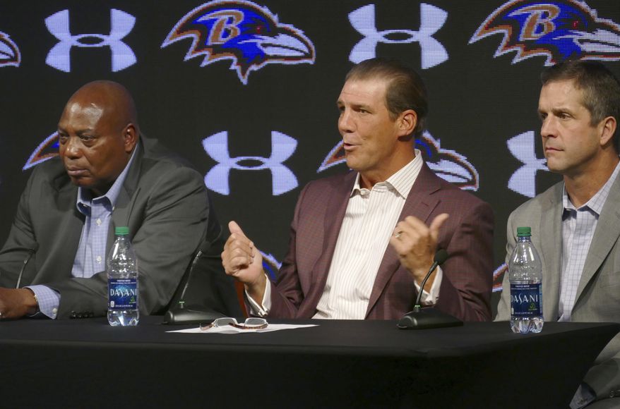 Baltimore Ravens owner Steve Bisciotti, center, speaks as general manager Ozzie Newsome,left, and coach John Harbaugh llisten during an NFL football news conference, Tuesday, Jan. 10, 2017, in Owings Mills, Md. (Kevin Richardson/The Baltimore Sun via AP)
