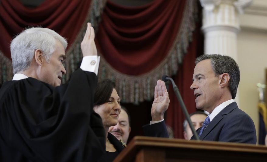 Texas Speaker of the House Joe Straus, R-San Antonio, right, is sworn in by Texas Chief Justice Nathan Hecht, left, in the House Chamber at the Texas State Capitol after he was re-elected during the opening of the 85th Texas Legislative session, Tuesday, Jan. 10, 2017, in Austin, Texas. (AP Photo/Eric Gay)