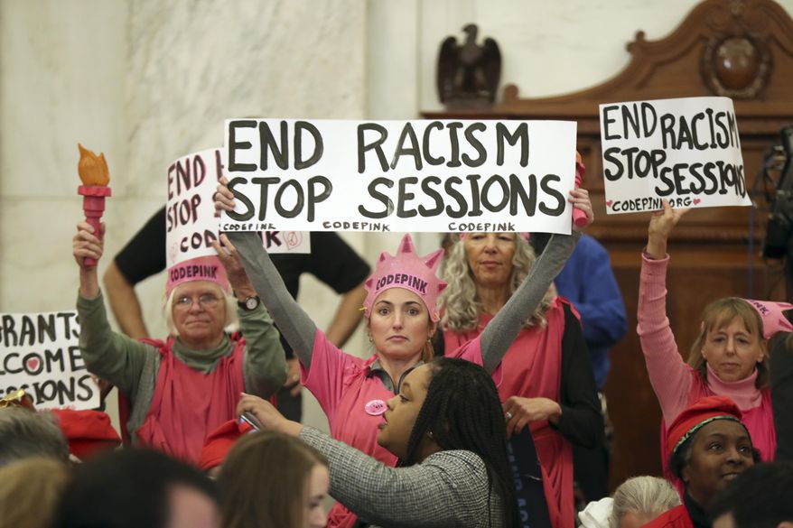 Protestors from CodePink, including co-founder Medea Benjamin take part in a demonstration on Capitol Hill in Washington, Tuesday, Jan. 10, 2017, during Senate Judiciary Committee&#x27;s confirmation hearing for Attorney General-designate, Sen. Jeff Sessions, R-Ala. (AP Photo/Andrew Harnik)
