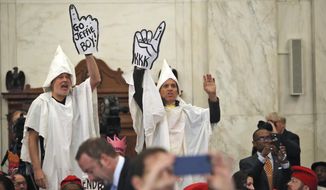 Demonstrators are seen on Capitol Hill in Washington, Tuesday, Jan. 10, 2017, during the Senate Judiciary Committee&#39;s confirmation hearing for Attorney General-designate, Sen. Jeff Sessions, R-Ala. (AP Photo/Andrew Harnik)