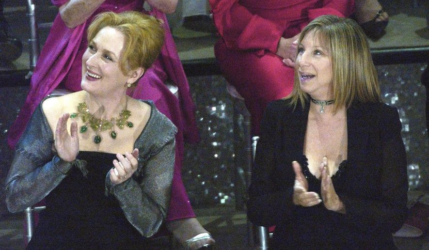 FILE - In this March 23, 2003, file photo, actresses Meryl Streep, left, and Barbra Streisand applaud on stage during a reunion of past Oscar winners during the 75th Academy Awards in Los Angeles. Streisand told MSNBC &amp;quot;Hardball” host Chris Matthews Monday that she completely agrees with Streep&#39;s criticisms of Trump during the Golden Globes on Sunday, Jan. 8, 2017. (AP Photo/Kevork Djansezian, File)