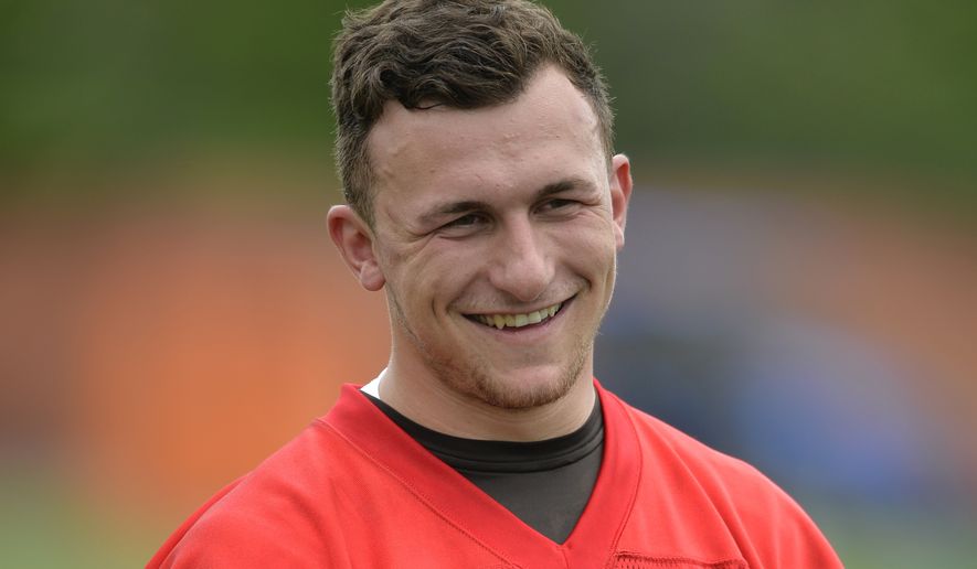 FILE - In this May 26, 2015, file photo, then-Cleveland Browns quarterback Johnny Manziel smiles during an NFL football organized team activity, in Berea, Ohio. Johnny Manziel will be in Houston ahead of the Super Bowl to give fans a chance to take a photo with the 2012 Heisman trophy winner — at a price. (AP Photo/David Richard, File)