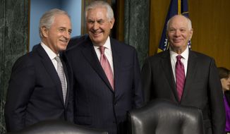 Senate Foreign Relations Committee Chairman Sen. Bob Corker, R-Tenn., right, and the committee&#39;s ranking member, Sen. Ben Cardin, D-Md., stand with Secretary of State-designate Rex Tillerson on Capitol Hill in Washington, Wednesday, Jan. 11, 2017, prior to the start of Tillerson&#39;s confirmation hearing before the committee. (AP Photo/Steve Helber)