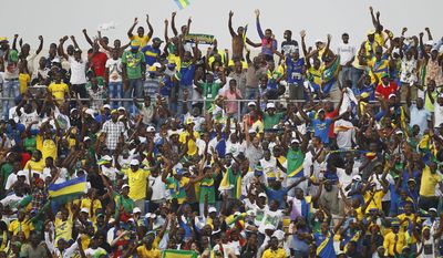 FILE - In this Monday, Jan. 23, 2012 file photo, Gabon fans celebrate after their national team scored against Niger in their African Cup of Nations Group C soccer match at Stade De L&#39;Amitie in Libreville, Gabon. The African Cup of Nations returns to Gabon for the second time in five years with the kickoff on Saturday Jan. 14, 2017 and the final on Feb. 5. (AP Photo/Francois Mori, file)