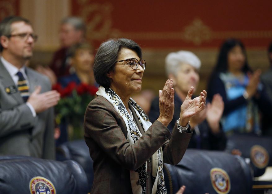 New Colorado State Senate Minority leader Lucia Guzman, D-Denver, applauds during the opening session of the 2017 Colorado Legislature, at the Capitol, in Denver, Wednesday Jan. 11, 2017. The Colorado Democratic House and Republican Senate are waiting for cues from Washington and from Democratic Gov. John Hickenlooper about the priorities this year. (AP Photo/Brennan Linsley)