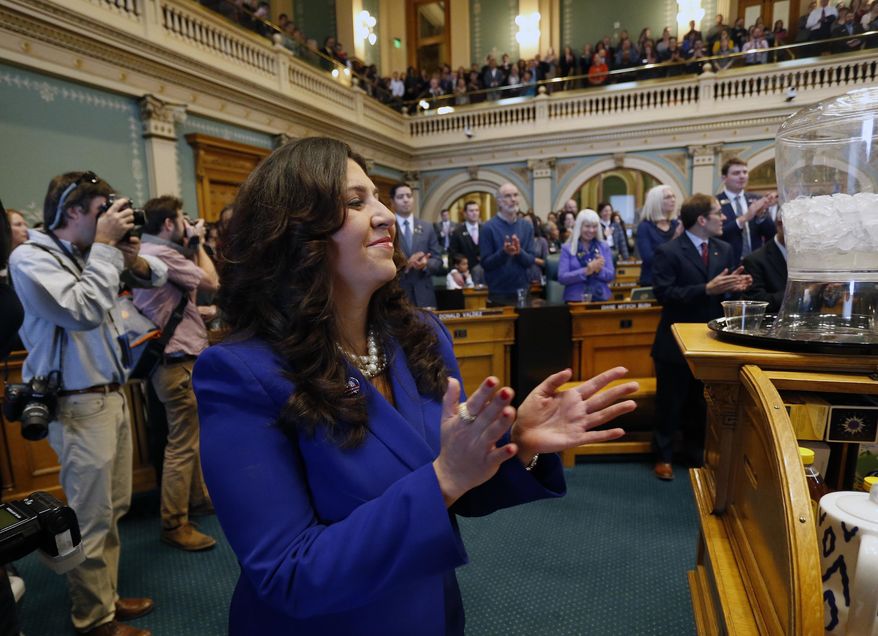 New House Speaker Crisanta Duran, D-Denver, applauds during the opening session of the 2017 Colorado Legislature, at the Capitol, in Denver, Wednesday Jan. 11, 2017. The Colorado Democratic House and Republican Senate are waiting for cues from Washington and from Democratic Gov. John Hickenlooper about the priorities this year. (AP Photo/Brennan Linsley)