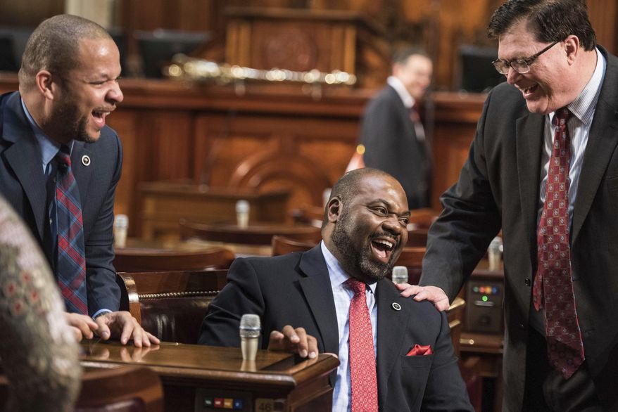 Rep. Samuel Rivers, R-Berkeley, center, laughs with Rep. Jay Lucas, R-Darlington, right, and Rep John King, D-York, left, before the state of the state address by Gov. Nikki Haley at the state Capitol, Wednesday, Jan. 11, 2017, in Columbia, S.C. (AP Photo/Sean Rayford)