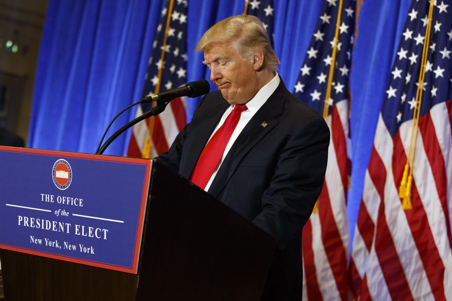 President-elect Donald Trump pauses during a news conference in the lobby of Trump Tower in New York, Wednesday, Jan. 11, 2017. (AP Photo/Evan Vucci)