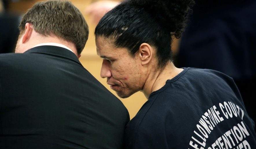 In this Tuesday, Jan. 10, 2017 photo, Todd Michael Johnson speaks to his lawyer at the Yellowstone County Courthouse in Billings, Mont. Johnson, who was charged with assaulting four women during a six-month period in 2014, was sentenced Tuesday to 40 years in prison. (Bronte Wittpenn /The Billings Gazette via AP)