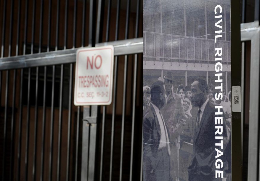 This Monday, Jan. 9, 2017, photo shows the locked gate and a historic marker at the now-abandoned A.G. Gaston Motel in Birmingham, Ala. Once used by the Rev. Martin Luther King Jr., the motel will be renovated as the city's civil rights district joins the National Park Service under a proclamation signed by President Barack Obama on Thursday, Jan. 12. (AP Photo/Jay Reeves)