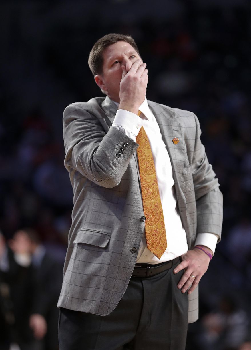 Clemson head coach Brad Brownell looks up at the scoreboard in the second half of an NCAA college basketball game against Georgia Tech Thursday, Jan. 12, 2017, in Atlanta. Tech won 75-63. (AP Photo/John Bazemore)