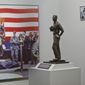 A maquette of Gerald R. Ford, left, is on display at the Gerald R. Ford Presidential Museum in Grand Rapids on Wednesday, Jan. 11, 2017. The maquette is a smaller version of a statue onboard the USS Gerald R. Ford supercarrier created by sculptor Brett Grill (Cory Morse/The Grand Rapids Press/MLive.com via AP)