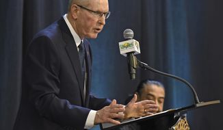 Jacksonville Jaguars new Executive Vice President of Football Operations, Tom Coughlin, speaks during a press conference as team owner Shad Khan, rear, looks on at EverBank Stadium in Jacksonville, Fla., Thursday, Jan. 12, 2017.   (Bob Self/The Florida Times-Union via AP)