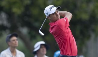 Justin Thomas follows his drive off the 11th tee during the first round of the Sony Open golf tournament, Thursday, Jan. 12, 2017, in Honolulu. (AP Photo/Marco Garcia)