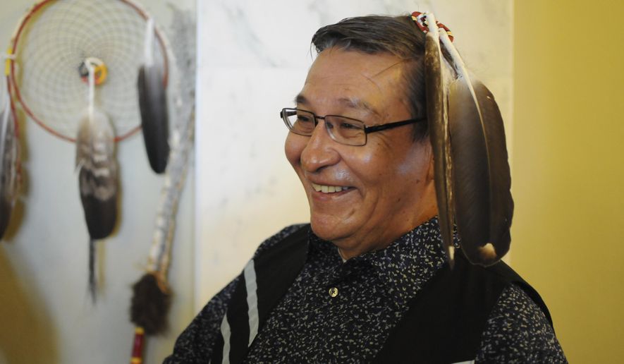 Yankton Sioux tribal Chairman Robert Flying Hawk waits to give a State of the Tribes address to the state Legislature in Pierre, S.D., Thursday, Jan. 12, 2017. (AP Photo/James Nord)