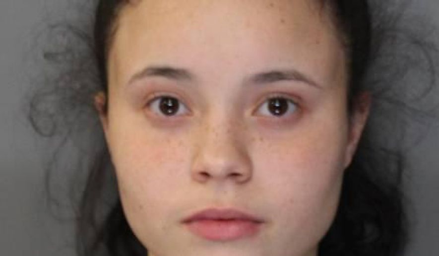 In this Jan. 11, 2017 photo provided by the City of Syracuse Police Department, Sheahonni Davis, 17, is shown after her arrest Wednesday in Syracuse, N.Y. Davis was arrested with two men and charged with fatally shooting two Cuban-born teenage brothers in what Syracuse police said was an attempted robbery that she set up. (City of Syracuse Police Department via AP)