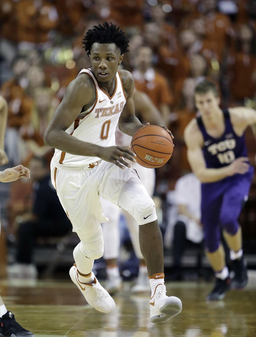 FILE - In this Jan. 11, 2017, file photo, Texas guard Tevin Mack (0) moves the ball up court against the TCU during the second half of an NCAA college basketball game, in Austin, Texas. Texas has suspended Mack indefinitely for an unspecified violation of team rules. (AP Photo/Eric Gay)