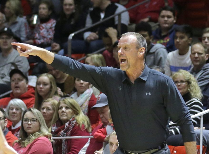 Utah head coach Larry Krystkowiak shouts to his team in the first half during an NCAA college basketball game against Southern California Thursday, Jan. 12, 2017, in Salt Lake City. (AP Photo/Rick Bowmer)