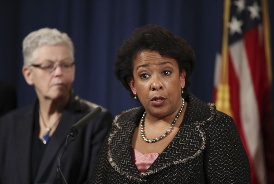 Attorney General Loretta Lynch with Environmental Protection Agency (EPA) Administrator Gina McCarthy, speaks during a news conference at the Justice Department in Washington, Wednesday, Jan. 11, 2017, announcing criminal and civil resolutions with Volkswagen. Volkswagen pleads guilty to 3 charges, will pay $4.3 billion penalty for emissions cheating and wide-ranging cover-up. (AP Photo/Manuel Balce Ceneta)
