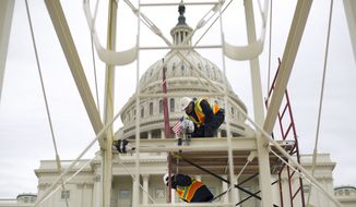 In this Dec. 8, 2016, file photo, construction continues on the Inaugural platform in preparation for the inauguration and swearing-in ceremonies for President-elect Donald Trump, on the Capitol steps in Washington, D.C. (AP Photo/Pablo Martinez Monsivais, File)