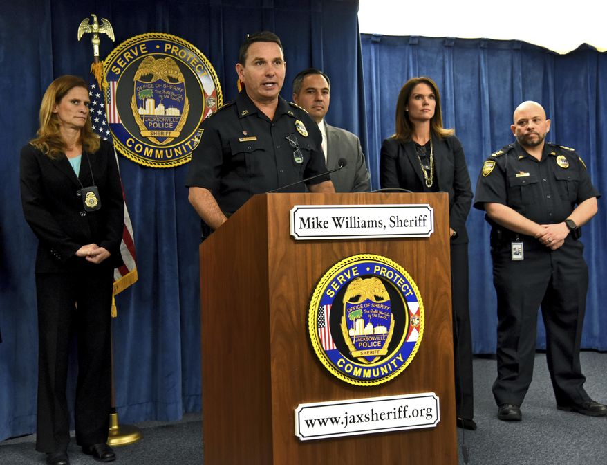 Jacksonville Sheriff Mike Williams, center, speaks during a news conference Friday, Jan. 13, 2017, in Jacksonville, Fla., where it was announced they found Kamiyah Mobley alive and well in South Carolina. Mobley was kidnapped from a Jacksonville hospital as a newborn 18 years ago. Police arrested Gloria Williams, 51, of Walterboro, S.C., at the home Mobley was living in and charged her with kidnapping and interference with custody. (Bob Mack/The Florida Times-Union via AP)