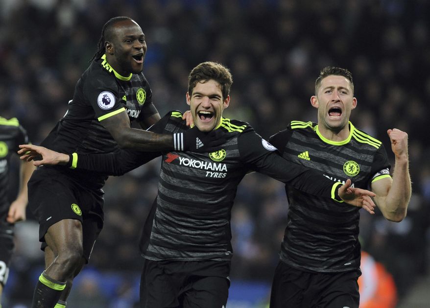 Chelsea's Marcos Alonso, centre, celebrates scoring his second goal during the English Premier League soccer match between Leicester City and Chelsea at the King Power Stadium in Leicester, England, Saturday, Jan. 14, 2017. (AP Photo/Rui Vieira)
