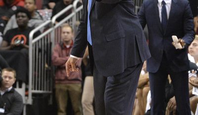 Duke coach Jeff Capel shouts instructions to his team during the first half of an NCAA college basketball game against Louisville, Saturday, Jan. 14, 2017, in Louisville, Ky. (AP Photo/Timothy D. Easley)