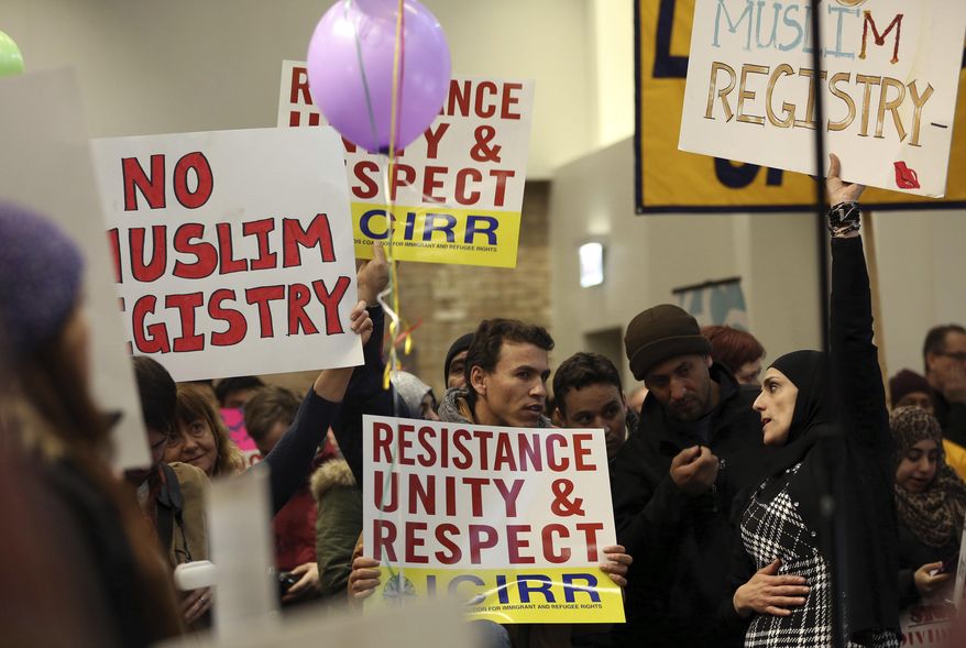Demonstrators gather for a rally supporting immigrant rights, Saturday, Jan. 14, 2017 in Chicago. Immigrant rights advocates are planning demonstrations across the country in what they're calling a "first salvo" against President-elect Donald Trump's pledged hard line on immigration. (Abel Uribe/Chicago Tribune via AP)