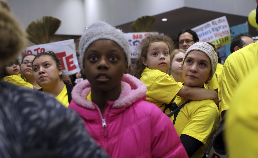 Demonstrators gather for a rally supporting immigrant rights, Saturday, Jan. 14, 2017 in Chicago. Immigrant rights advocates are planning demonstrations across the country in what they're calling a "first salvo" against President-elect Donald Trump's pledged hard line on immigration. (Abel Uribe/Chicago Tribune via AP)