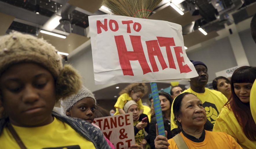 Demonstrators gather for a rally supporting immigrant rights, Saturday, Jan. 14, 2017 in Chicago. Immigrant rights advocates are planning demonstrations across the country in what they're calling a "first salvo" against President-elect Donald Trump's pledged hard line on immigration. (Abel Uribe/Chicago Tribune via AP)