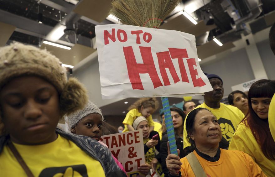 Demonstrators gather for a rally supporting immigrant rights, Saturday, Jan. 14, 2017 in Chicago. Immigrant rights advocates are planning demonstrations across the country in what they're calling a "first salvo" against President-elect Donald Trump's pledged hard line on immigration. (Abel Uribe/Chicago Tribune via AP)