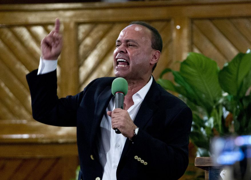 Rep. Luis Gutierrez D-Ill., speaks to immigrant rights advocates during a rally against President-elect Donald Trump's immigration policies, at Metropolitan AME Church in Washington, Saturday, Jan. 14, 2017. ( AP Photo/Jose Luis Magana)