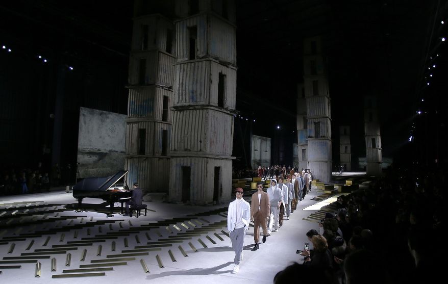Models wear creations for Ermenegildo Zegna men's Fall-Winter 2017-2018 collection, part of the Milan Fashion Week, unveiled in Milan, Italy, Friday, Jan. 13, 2017. (AP Photo/Antonio Calanni)