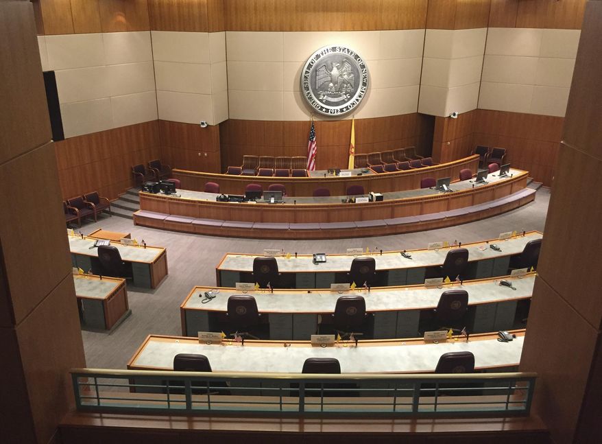 The lights are on again in the New Mexico state Senate in Santa Fe, N.M., on Friday, Jan. 13, 2017, in anticipation of the legislative session. New Mexico lawmakers are confronting budget shortfalls, frustration over a weak economy, and concerns about violent crime and school performance as they convene on Tuesday, Jan. 17. (AP Photo/Morgan Lee)
