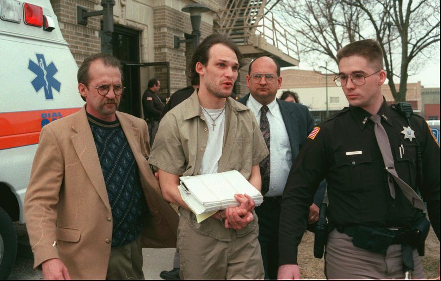 File-This Wednesday, Feb. 21, 1996 file photo shows John Lotter, center, being escorted from the Richardson County Courthouse in Falls City, Neb., after being sentenced to death for the December 1993 murders of Teena Brandon, Phillip DeVine and Lisa Lambert, a crime that inspired the movie "Boys Don't Cry". Attorneys for Lotter argue that he had a right to have jurors, not judges, weigh his fate when he was sentenced to death in 1996. The attorneys cite a U.S. Supreme Court ruling last year that struck down Florida’s death penalty process, saying it gave too much power to judges to make the ultimate decision. After that ruling, Delaware’s high court followed suit and threw out that state’s death penalty-determining method. (Eric Keith/The St. Joseph News-Press via AP, File)