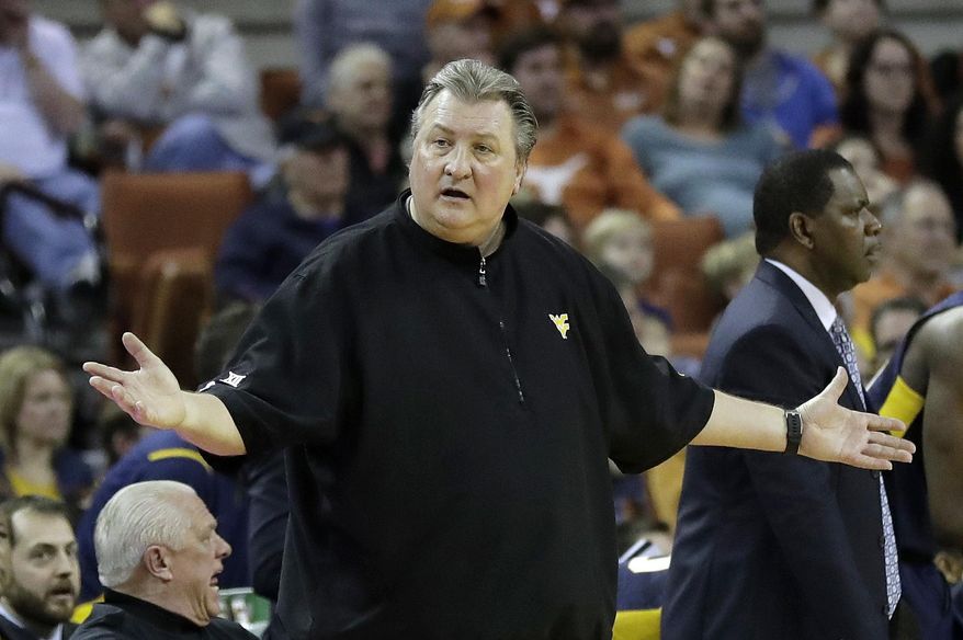 West Virginia head coach Bob Huggins questions a call during the second half of an NCAA college basketball game against Texas, Saturday, Jan. 14, 2017, in Austin, Texas. West Virginia won 74-72. (AP Photo/Eric Gay)