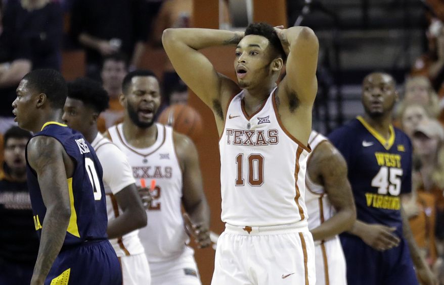 Texas guard Eric Davis Jr. (10) reacts after he was called for a foul during the second half of an NCAA college basketball game against West Virginia, Saturday, Jan. 14, 2017, in Austin, Texas. West Virginia won 74-72. (AP Photo/Eric Gay)