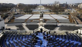 Preparations take place Sunday, Jan. 15, 2017, in Washington, following a rehearsal of the swearing-in ceremony for President-elect Donald Trump. (AP Photo/Patrick Semansky)