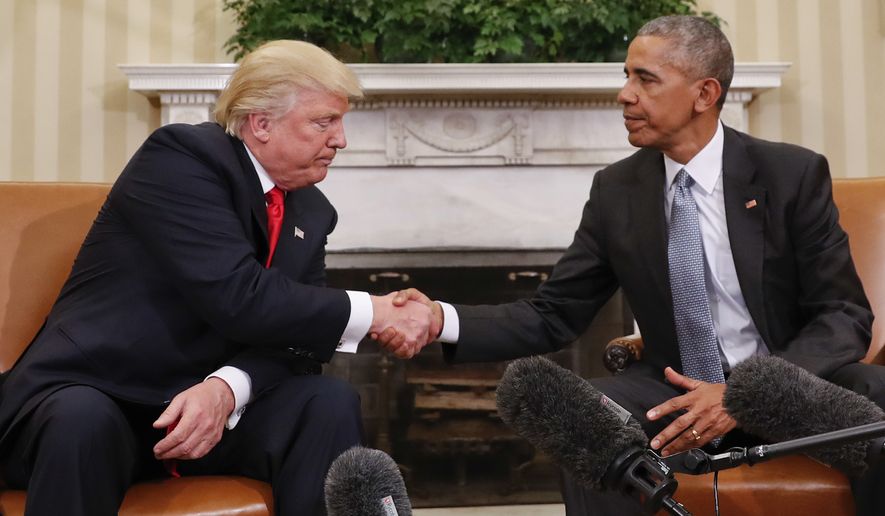 In this Nov. 10, 2016 photo, President Barack Obama and President-elect Donald Trump shake hands following their meeting in the Oval Office of the White House in Washington.   (AP Photo/Pablo Martinez Monsivais)