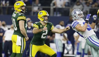 Green Bay Packers kicker Mason Crosby (2) watches his 51-yard field goal to win the game as time expires during the second half of an NFL divisional playoff football game against the Dallas Cowboys Sunday, Jan. 15, 2017, in Arlington, Texas. The Packers won 34-31. (AP Photo/LM Otero)
