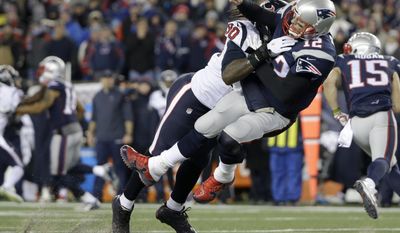 Houston Texans defensive end Jadeveon Clowney (90) levels New England Patriots quarterback Tom Brady (12) after Brady released a pass during the first half of an NFL divisional playoff football game, Saturday, Jan. 14, 2017, in Foxborough, Mass. (AP Photo/Elise Amendola)