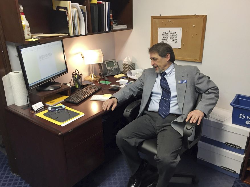 Republican Representative-elect George Rauscher sits in his office at the Alaska Capitol on Monday, Jan. 16, 2017, in Juneau, Alaska. Rauscher is among the newly elected legislators who will be sworn in Tuesday. Among Alaska's newest legislators, there is optimism and an eagerness to get to work on addressing the state's multibillion-dollar budget deficit. (AP Photo/Becky Bohrer)