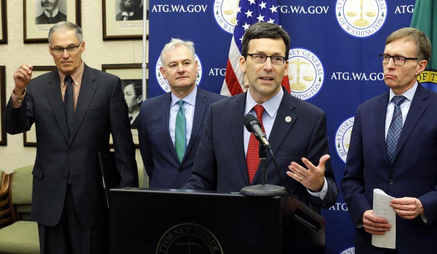 Attorney General Bob Ferguson, second from right, speaks Monday, Jan. 16, 2017, during a news conference at the Capitol in Olympia, Wash. to announce that he and Washington Gov. Jay Inslee, left, have proposed legislation to abolish the death penalty in Washington state. (AP Photo/Ted S. Warren)