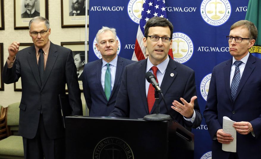 Attorney General Bob Ferguson, second from right, speaks Monday, Jan. 16, 2017, during a news conference at the Capitol in Olympia, Wash. to announce that he and Washington Gov. Jay Inslee, left, have proposed legislation to abolish the death penalty in Washington state. (AP Photo/Ted S. Warren)