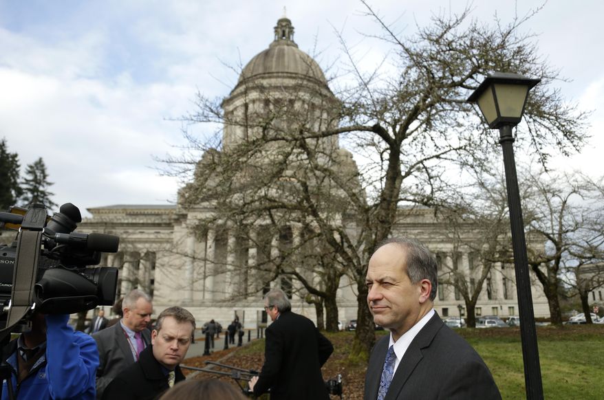 Sen. Steve O'Ban, R-University Place, right, talks to reporters Monday, Jan. 16, 2017, outside the Legislative Building at the Capitol in Olympia, Wash. O'Ban, who is the vice-chair of the Senate Law & Justice Committee, said he opposed legislation proposed Monday by Gov. Jay Inslee and Attorney General Bob Ferguson to abolish the death penalty in Washington state. (AP Photo/Ted S. Warren)