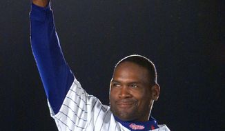 ADVANCE FOR WEEKEND EDITIONS JAN. 14-15 - FILE - In this April 6, 2001, file photo, Montreal Expos&#39; Tim Raines acknowledges applause from fans as he is presented before the Expos home opener in Montreal. Raines could be elected into the Baseball Hall of Fame when voting is announced Wednesday, Jan. 18, 2016. (AP Photo/Ryan Remiorz, File)