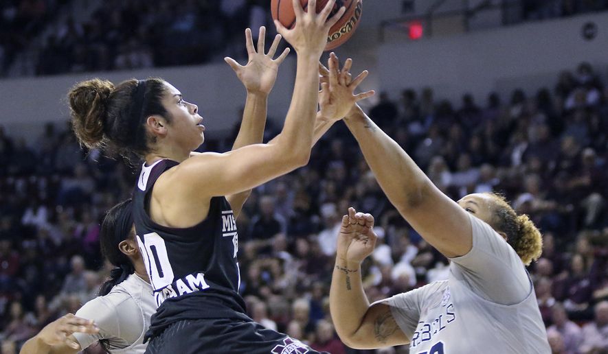 Mississippi State guard Dominique Dillingham (00) shoots over Mississippi forward Taylor Manuel (50) during the first half of an NCAA college basketball game in Starkville, Miss., Monday, Jan. 16, 2017. (AP Photo/Jim Lytle)