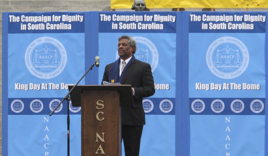 South Carolina NAACP Executive Director Dwight James welcomes marchers to the organization's MLK King Day at the Dome rally at the South Carolina Statehouse on Monday, Jan. 16, 2017, in Columbia, South Carolina. Monday's King Day at the Dome rally was the second since the Confederate flag was removed from Statehouse grounds and one of the most sparsely attended since the event began in 2000. (AP Photo/Jeffrey Collins)