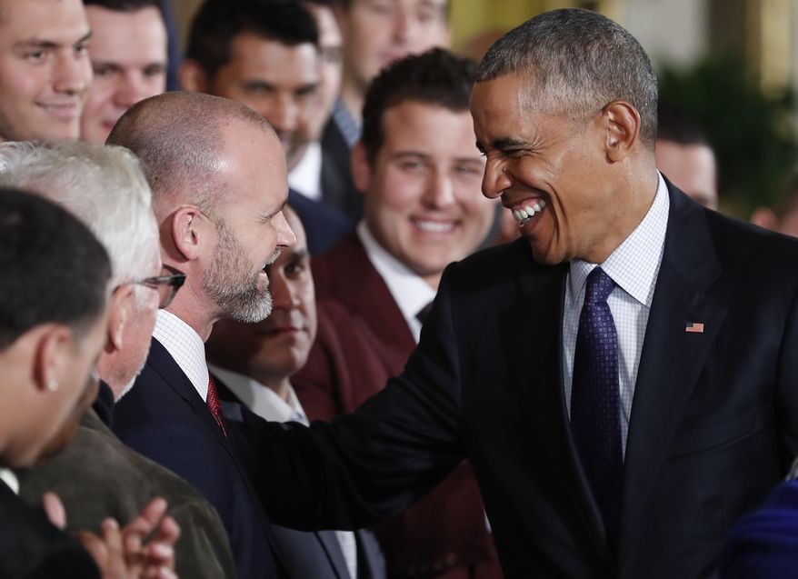 President Barack Obama talks with catcher David Ross during a ceremony in the East Room of the White House in Washington, Monday, Jan. 16, 2017, where the president honored the 2016 World Series Champion Chicago Cubs baseball team. The Cubs have appointed Ross as special assistant to baseball operations. (AP Photo/Carolyn Kaster)